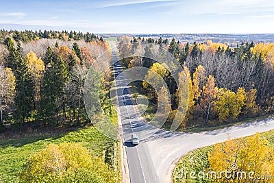 Aerial view of country road surrounded by colorful autumn trees Editorial Stock Photo