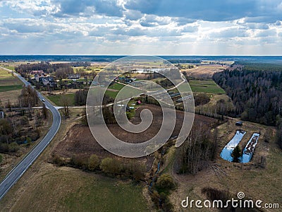 aerial view of country roads and small village with houses and lake Stock Photo