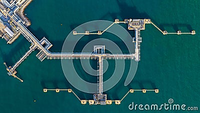 Aerial view crude oil terminal, Loading arm oil and gas refinery at commercial port Stock Photo