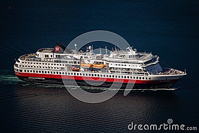 Aerial view of a cruiser sailing on a dark blue ocean surface, near Tromso in northern Norway Editorial Stock Photo