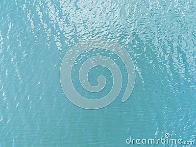 Aerial view of a Crystal clear sea water texture. View from above Natural blue background. Turquoise ripple water reflection in tr Stock Photo