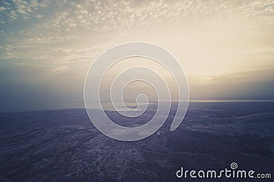 Aerial view of dawn over the dead sea. Beautiful panorama of foggy Israeli sea and sea coast shot at sunrise. Sky meets Stock Photo