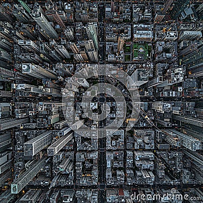 Aerial view of a densely built urban area displaying a grid-like street pattern. Stock Photo