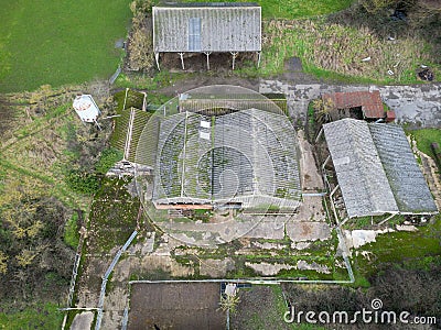 Aerial view of derelict farm buildings including hay barns and cow milking parlours. Stock Photo