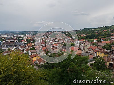 Aerial view of Doboj hilly suburbs from medieval fortress Gradina during overcast summer day Editorial Stock Photo
