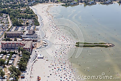 Aerial view Dutch village Makkum with beach and swimming people Stock Photo