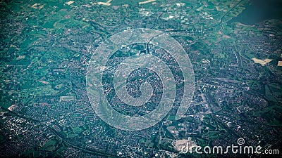 Aerial view of famous houses and roads of Amsterdam city from airplane window Stock Photo