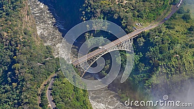 Aerial view of famous Victoria Falls Bridge, marking the border of Simbabwe and Sambia (Africa), over Sambesi River. Stock Photo