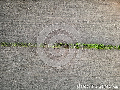 Aerial view field nature agricultural farm background, top view plowed field from above agricultural parcels of different furrows Stock Photo