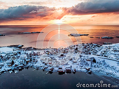 Aerial view of fishing village on seashore in winter at sunrise Stock Photo