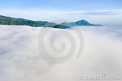 Aerial view of fluffy white clouds and highlands Stock Photo