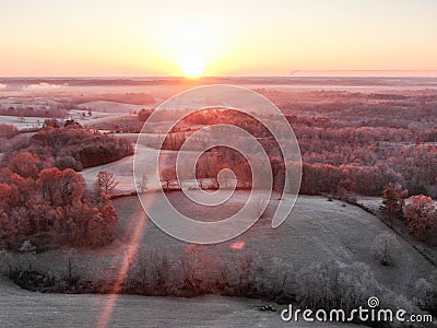 Aerial view of a frosty misty landscape at sunrise Stock Photo