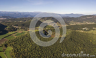 Aerial view of Garrotxa Volcanic Zone Natural Park and Santa Margarida Volcano in the foreground Stock Photo