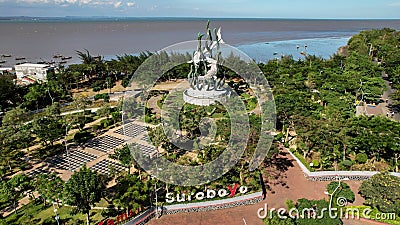 Aerial view of the A giant shark and crocodile statue as a symbol of the city of Surabaya. A landmark or monument as an icon of Editorial Stock Photo