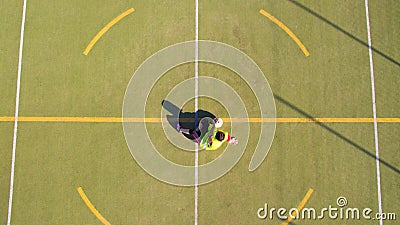 Aerial view of a girl who scores goals in a 5-a-side football pitch Stock Photo