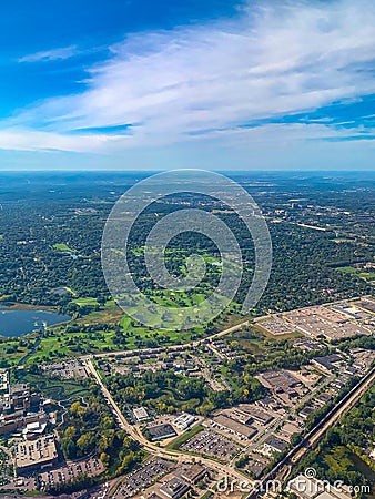 Aerial view of golf courses in a densely forested urban development Stock Photo