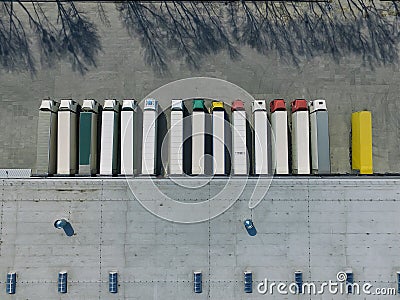 Aerial view of goods warehouse. Logistics center in industrial city zone from above. Stock Photo