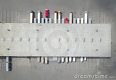 Aerial view of goods warehouse. Logistics center in industrial city zone from above. Stock Photo