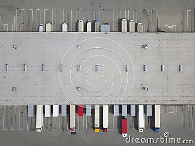 Aerial view of goods warehouse. Logistics center in industrial city zone from above. Stock Photo