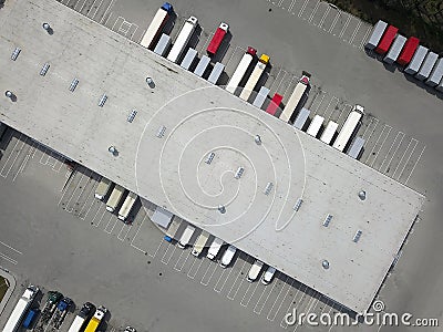 Aerial view of goods warehouse. Logistics center in industrial city zone from above. Stock Photo