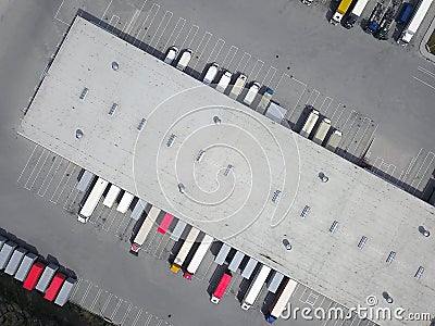 Aerial view of goods warehouse. Logistics center in industrial city zone from above. Stock Photo