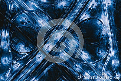Aerial view of highway junctions. Bridge roads shape number 8 or infinity sign in structure of architecture concept. Top view. Stock Photo