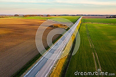 Aerial view of a highway passing through spring agricultural fields Stock Photo