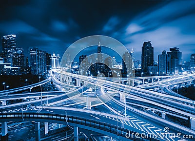 Aerial view of highways in Shanghai Downtown, China. Financial district and business centers in smart city in Asia. Top view of Stock Photo