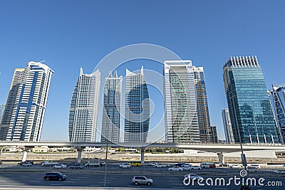 Aerial view of illuminated JLT skyscrapers. Towers along Sheikh Zayed Road. Stock Photo