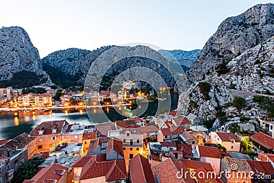 Aerial View on Illuminated Town of Omis Stock Photo