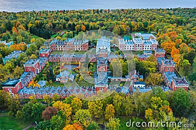 Aerial view of the imperial stables in the Gothic style in Peterhof. The complex is in the form of a trapezoid of red unplastered Stock Photo