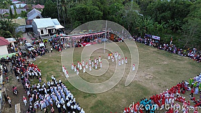 Aerial view of Indonesian flag lowering ceremony witnessed by villagers. Indonesia Independence Day Editorial Stock Photo