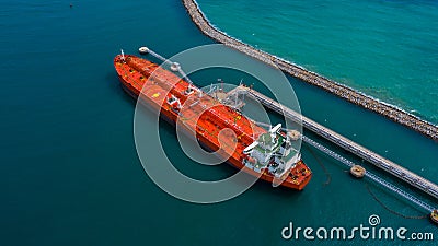 Aerial view industrial crude oil and fuel tanker ship cruising deep ocean sea, Tanker ship vessel unloading at port, Business Stock Photo