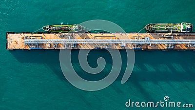 Aerial view industrial crude oil and fuel tanker ship at deep ocean sea port, Tanker ship vessel at terminal port, Business import Stock Photo