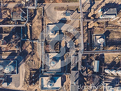 Aerial view of industrial factory or plant buildings with steel storage construction tanks and pipes, oil refinery concept Stock Photo