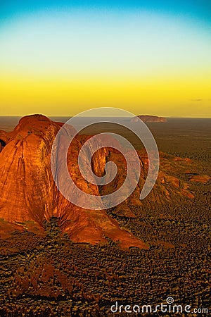 Aerial view of Kata Tjuta mountain in Australia covered in desert land at sunset Stock Photo