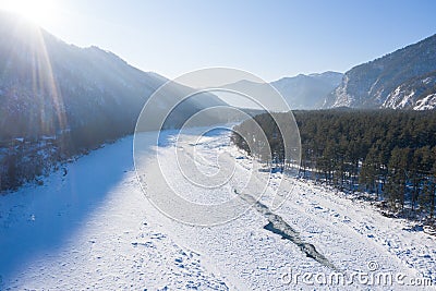 Aerial view of Katun river in winter. River covered by ice and snow in winter Stock Photo