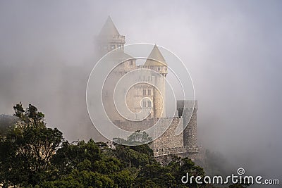 Castles covered with fog at the top of Bana Hills, the famous tourist destination of Da Nang, Vietnam. Near Golden bridge Stock Photo