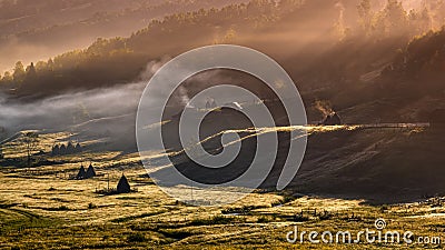 Aerial view landscape over remote village from Transylvania, Shepherd house in summer time in Romania Stock Photo