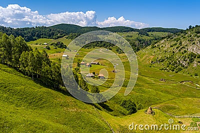 Aerial view landscape over remote village from Transylvania, Shepherd house in summer time in Romania Stock Photo