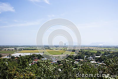 Aerial view landscape and rice field or paddy land from viewpoint of Wat Khao Sanam Chaeng temple with valley village hill for Stock Photo