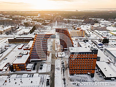 Aerial view of a large building with laboratories and innovative projects, technical inventions covered with snow on a winter day Stock Photo