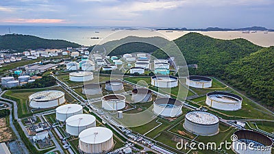 Aerial view of large fuel storage tanks at oil refinery industrial zone, White oil storage tanks farm. Stock Photo