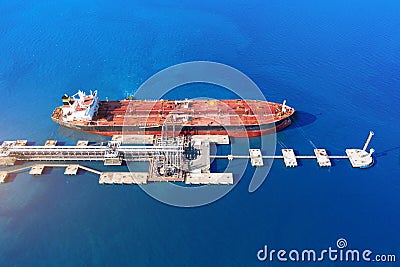 Aerial view large port oil loading terminal with large storage tanks. Railway infrastructure for the delivery of bulk cargo by sea Stock Photo