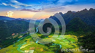 Aerial view of limestone mountains and rice field at sunset in Vang vieng, Laos Stock Photo