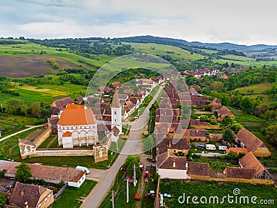 Aerial view. Medieval Saxon Church in Saschiz Village, Transylvania, Romania. Unesco World Heritage Site. fortified church and the Stock Photo