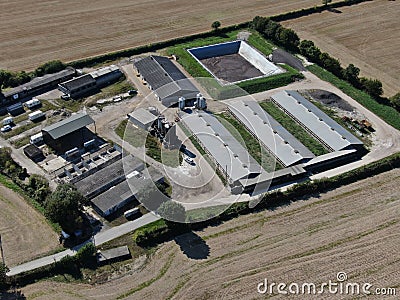 Aerial view of modern farm yard showing neat buildings and surrounded by ploughed fields Stock Photo