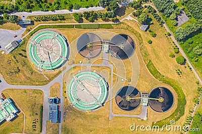 Aerial view of modern water cleaning facility at urban wastewater treatment plant. Purification process of removing undesirable Stock Photo