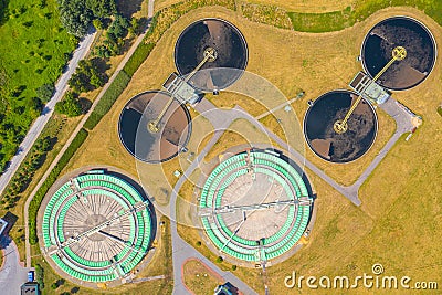 Aerial view of modern water cleaning facility at urban wastewater treatment plant. Purification process of removing undesirable Stock Photo