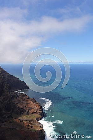 An aerial view of the Napali Coastline and the Pacific Ocean with boats sailing in the water in Kauai, Hawaii Stock Photo